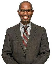 Headshot photo of Dr. Pilgrim against a white background